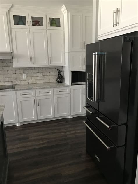 kitchens with black cabinets and stainless steel appliances|white kitchen cabinets black appliances.